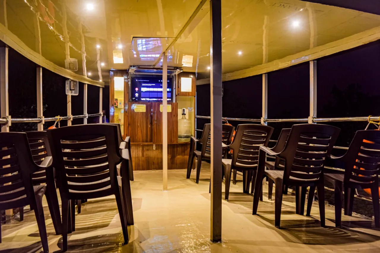 Upper deck common area of the Max Adventures houseboat at night